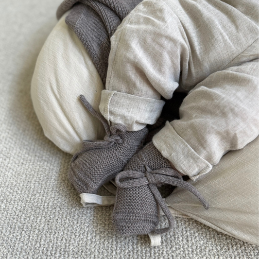 Hvid slofjes van merinowol otter