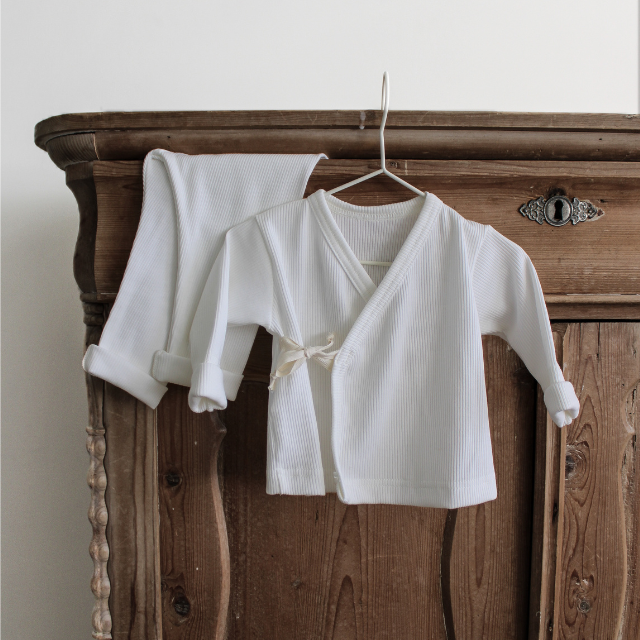 Two thirteen newborn set rib off white