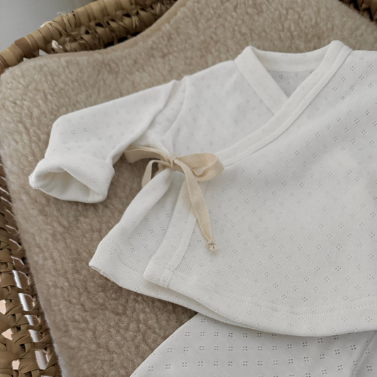 pointelle vest wrapped wit newborn